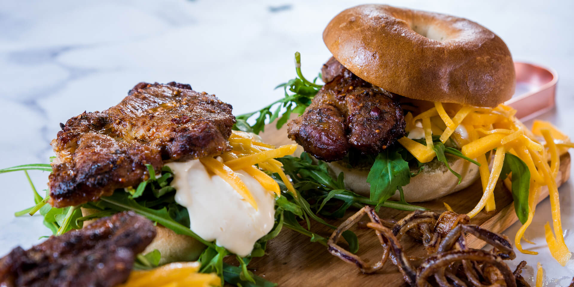 Prego Steak Bagel with a Butternut Pickle and DeepFried Red Onions